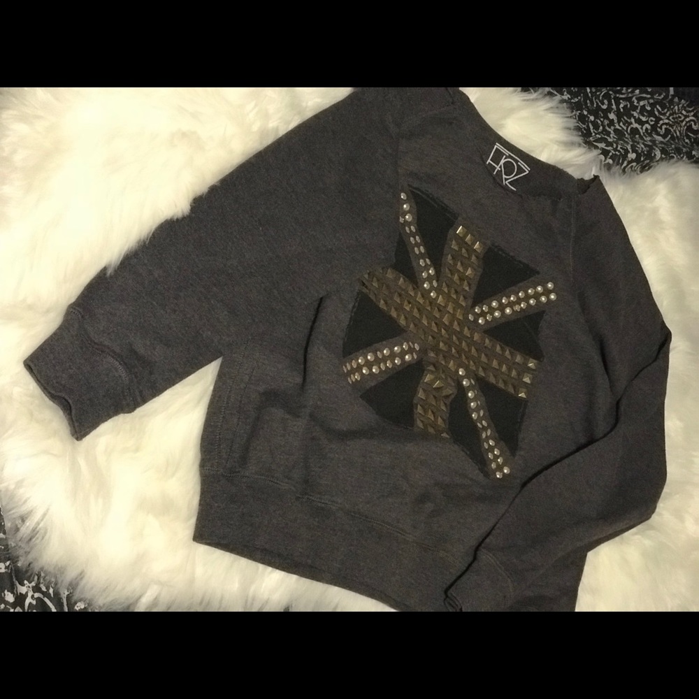 Grey off-shoulder sweater with embellishment
